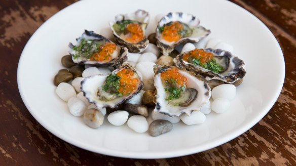 Oysters dressed with jalapeno and salmon caviar.