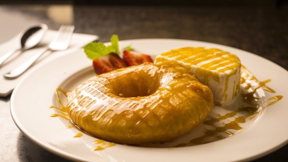 Pineapple fritter with ice-cream.