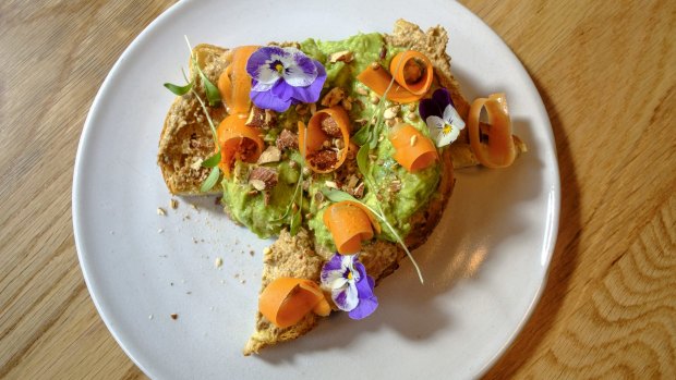 Avocado on toast with pickled carrot.