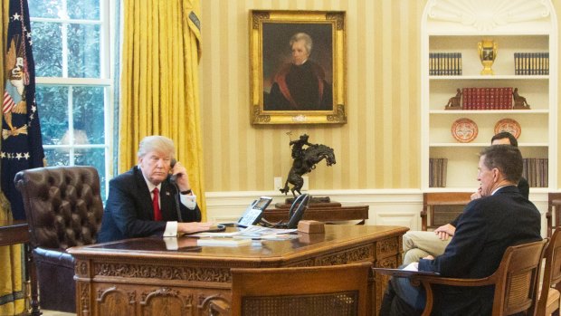 President Donald Trump, left, accompanied by National Security Adviser Michael Flynn, right, and Senior Advisor to the President Jared Kushner, speaks on the phone with King of Saudi Arabia Salman bin Abd al-Aziz Al Saud.