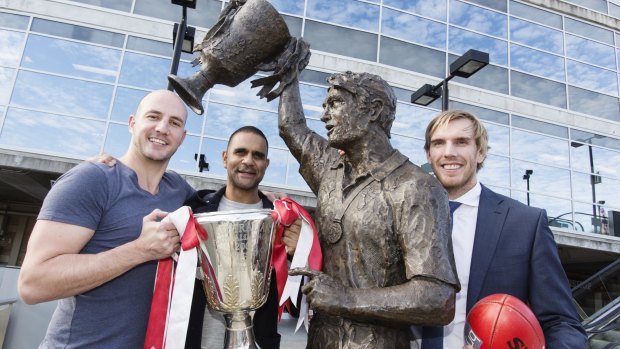10 years after: 2005 premiership players Tadhg Kennelly, Michael o'Loughlin and Lewis Roberts-Thomson with a statue of coach Paul Roos at the SCG on Tuesday.