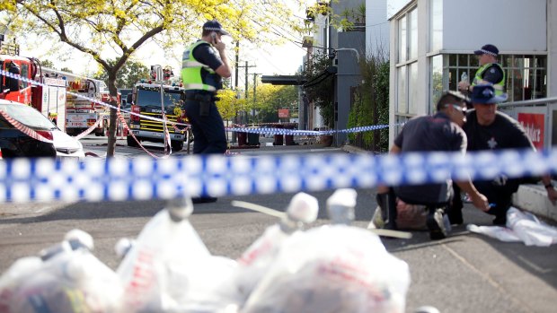 Police on the scene in the aftermath of last year's fire.