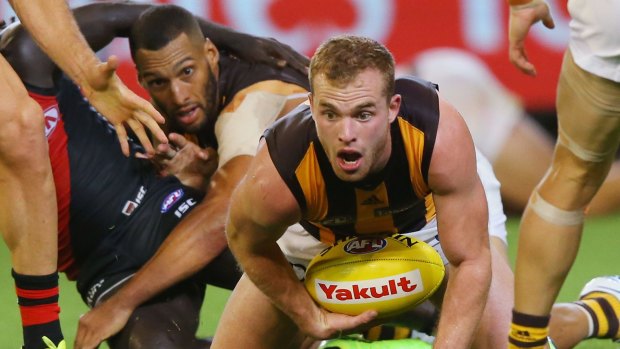 Mitchell I: New Hawk Tom Mitchell gathers the ball against the Bombers.