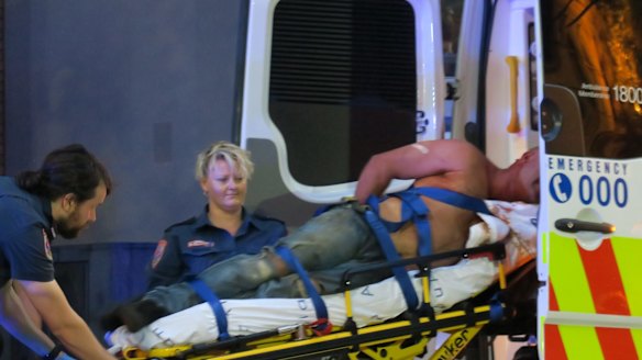 A man is taken to hospital after allegedly fighting with police during the Moomba festival.