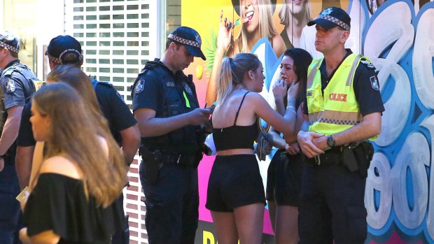 Thrills and spills: A girl in tears is consoled by her friend on the Gold Coast.