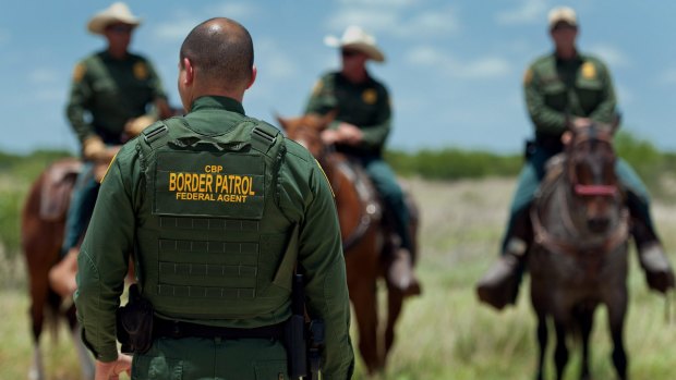 US Border Patrol agents work near Carrizzo Springs, Texas.