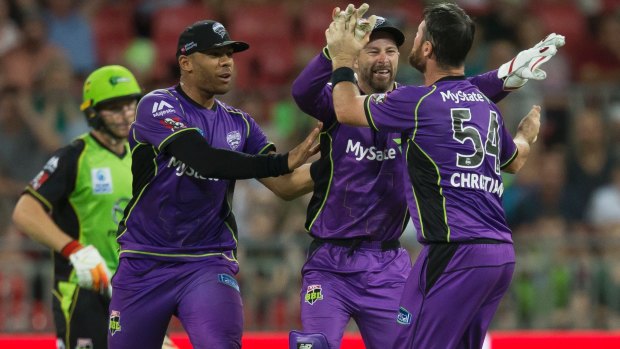 Key wicket: Matthew Wade of the Hurricanes celebrates after running out Jos Butler at Spotless Stadium.