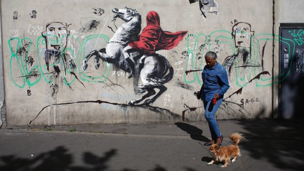 The provocative street artist Banksy is believed to have taken his message on migration to Paris.