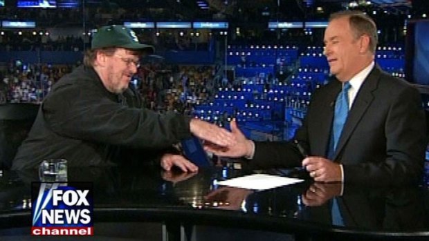Left-wing filmaker Michael Moore shakes hands with right-wing commentator Bill O'Reilly on Fox News in the US.