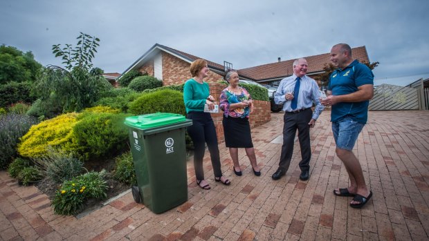 Calwell homeowner Stephen McDougall, one of the first residents in Tuggeranong who have opted in for the service, with ALP MLAs Meegan Fitzharris, Joy Burch and Mick Gentleman, earlier this month.