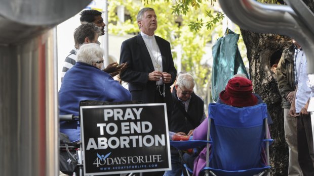 The Catholic Archbishop of Canberra and Goulburn, Christopher Prowse, joined a prayer vigil outside the Moore Street abortion clinic last year.