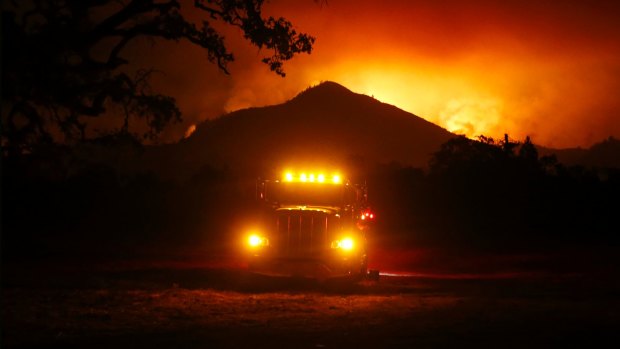 Flames rise from a hillside east of Santa Rosa, California last week.