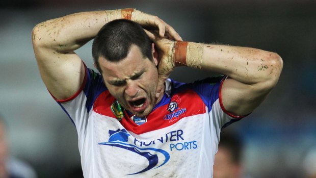 In pain: James McManus checks his head during a game in 2013.