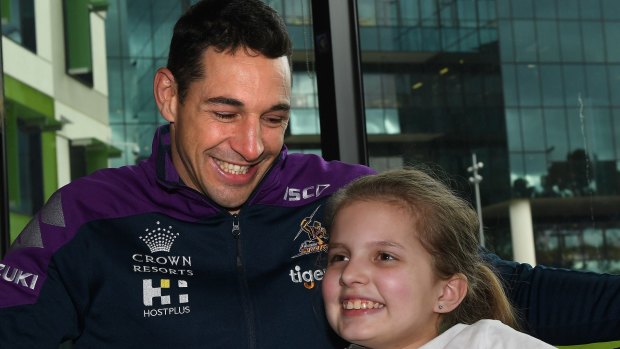 Melbourne Storm fullback and Starlight Children's Foundation ambassador Billy Slater with 12-year-old Courtney at the Royal Children's Hospital on Tuesday.
