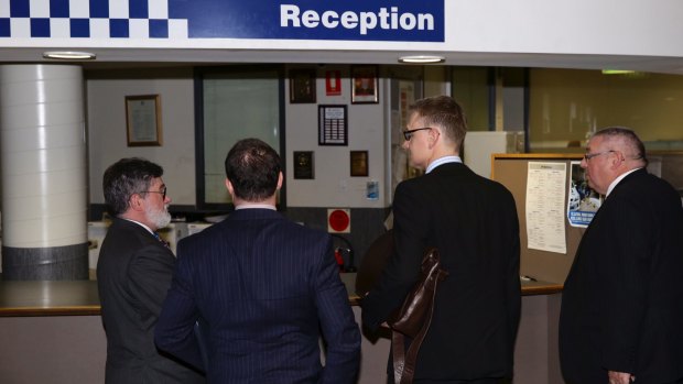 Legal representatives for Harriet Wran arrive at Cabramatta Police Station.
