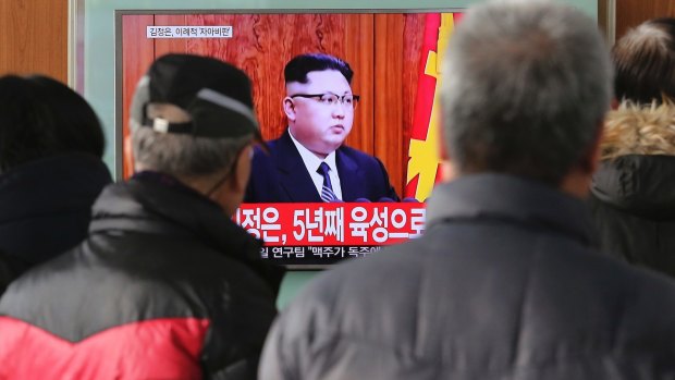 South Koreans at Seoul Railway Station watch North Korean leader Kim Jong-un's New Year speech.