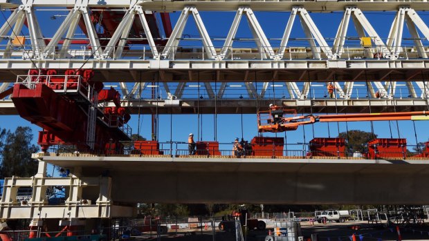 A Skytrain span being assembled by one of two massive movable gantries.