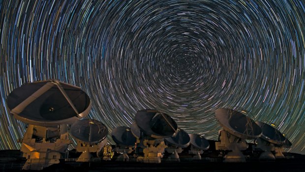 Long exposure of star trails around the south celestial pole and above the Atacama Large Millimeter Array, ALMA. 