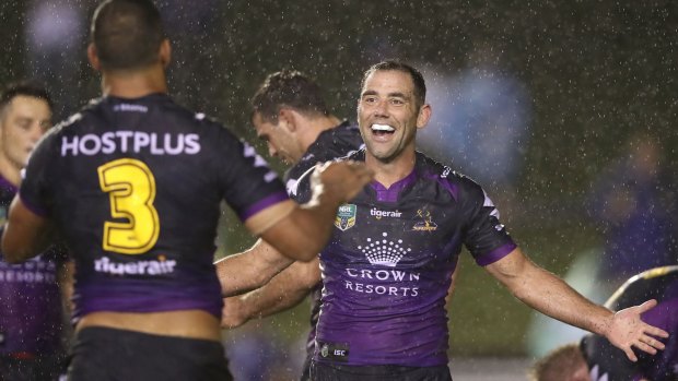 Top of the pile: Cameron Smith and Will Chambers celebrate a win. 