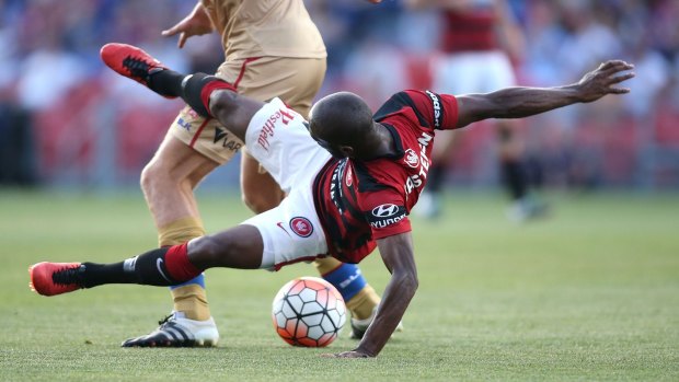 Romeo Castelen of the Wanderers contests the ball against the Jets at Hunter Stadium.