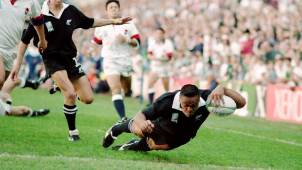 Rampagaing: Jonah Lomu scores during the 1995 Rugby World Cup against England in Cape Town.