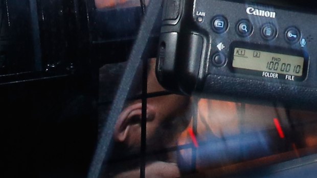 Omarjan Azari under police guard at Sydney's Central Local Court.