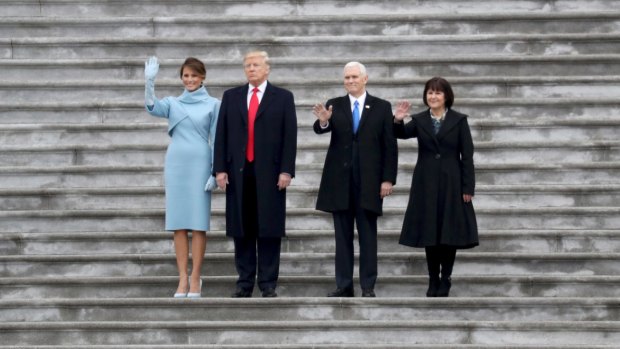 First lady Melania Trump, President Donald Trump, Vice-President Mike Pence and his wife, Karen Pence, farewell the Obamas.
