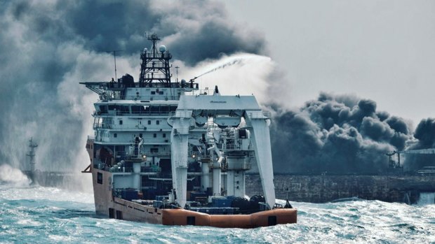 A firefighting boat works to put on a blaze on the oil tanker Sanchi in the East China Sea off the eastern coast of China on January 10, 2018.