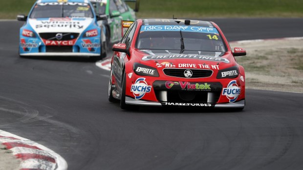 At last: Tim Slade races to his first Supercars victory in 227 starts. 