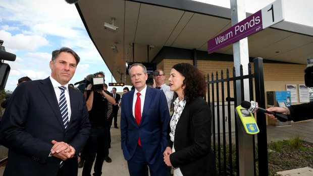 Shadow Immigration Minister Richard Marles, Opposition Leader Bill Shorten and ALP candidate for Corangamite Libby Coker address the media during a doorstop interview at the Waurn Ponds train station in Geelong.