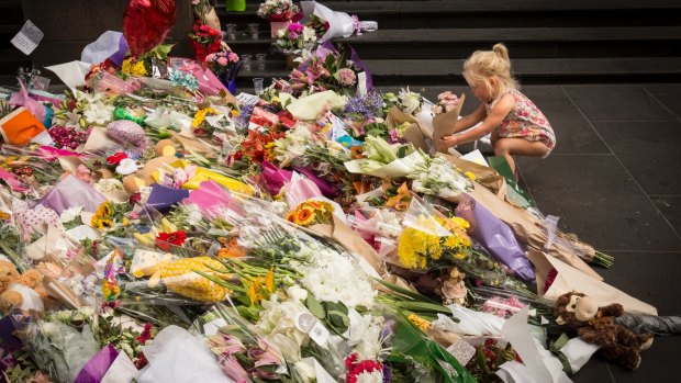 Hundreds of bunches of flowers were laid in Bourke Street in the wake of the tragedy.