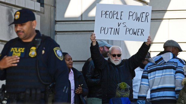 A protestor stands outside the court in Washington.