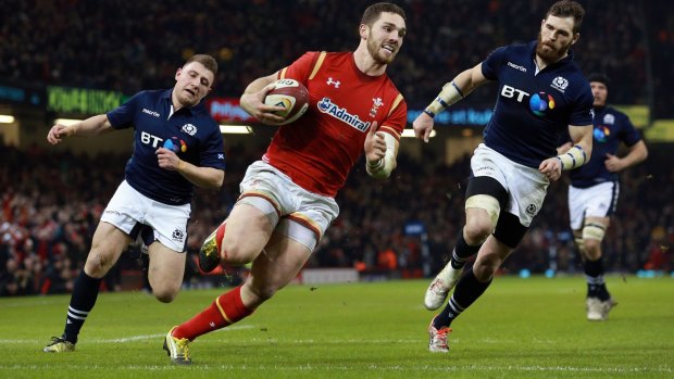 Rolling back the years: George North scores Wales' third try in Cardiff.
