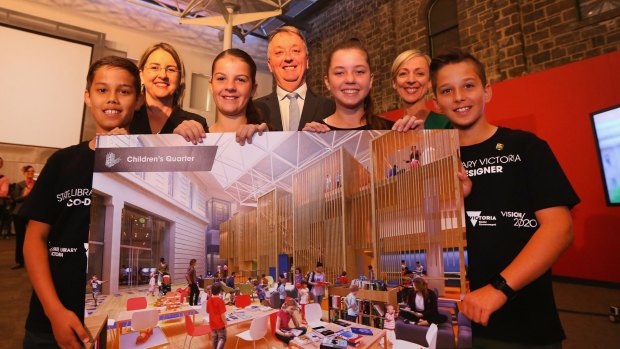 We helped make this: Keilor Primary students holding the final design for the Children's Quarter at the State Library of Victoria, which they contributed ideas to. Pictured with Creative Industries Minister Martin Foley (centre) and Major Projects minister Jacinta Allan (left, rear) and State Library CEO Kate Torney (right, rear).