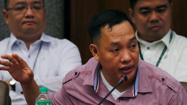 Philippine police officer Ricky Santa Isabel, who was allegedly involved in the kidnapping and subsequent killing of South Korean businessman Jee Ick-joo, testifies at the Senate probe.