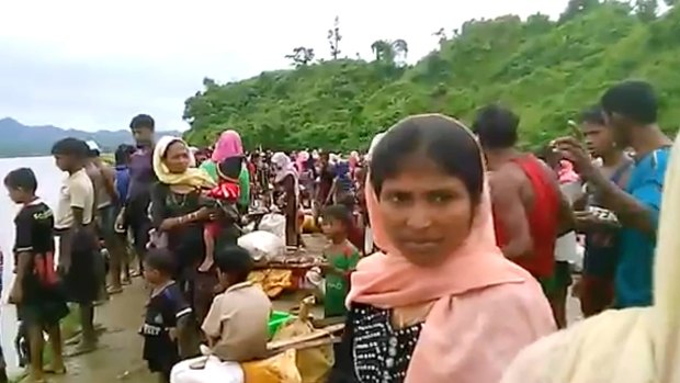 Video released by Arakan Rohingya National Organisation shows villagers preparing to cross a river towards the Maungdaw township in the Rakhine state that borders Bangladesh. 
