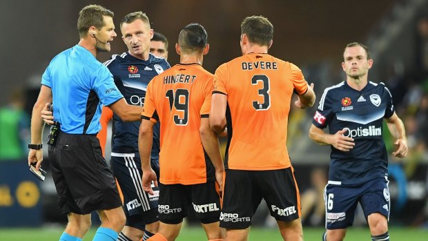 Melbourne Victory's Besart Berisha argues with the referee after being given a red card.