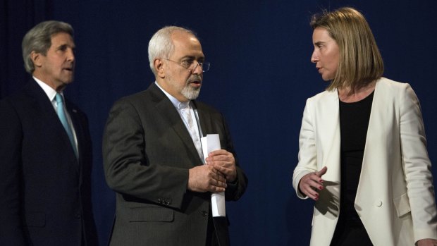 US Secretary of State John Kerry, Iranian Foreign Minister Javad Zarif and EU High Representative for Foreign Affairs Federica Mogherini arrive to deliver a statement in Lausanne.