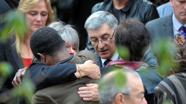 Ian and Sue Jones consoled at their children's funeral 