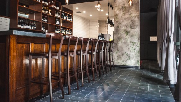 La Lune's handsome bar with century-old oak paneling. 