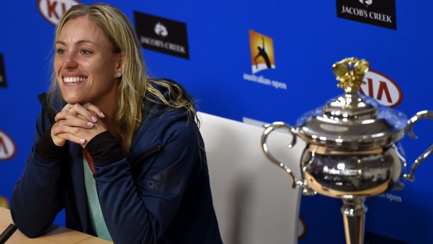 Angelique Kerber of Germany beams during a press conference following her win over Serena Williams.