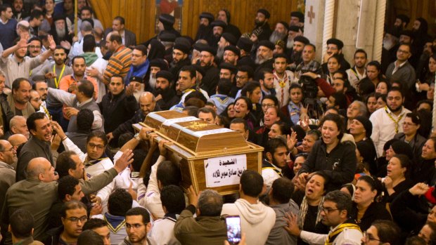 Relatives of Coptic Christians grieve as they carry the coffin of Nermin Sadek, one of the victims of the militants attack on Mar Mina church.
