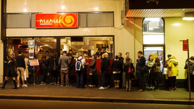 People queuing to enter Mamak restaurant in Chinatown, Sydney. 