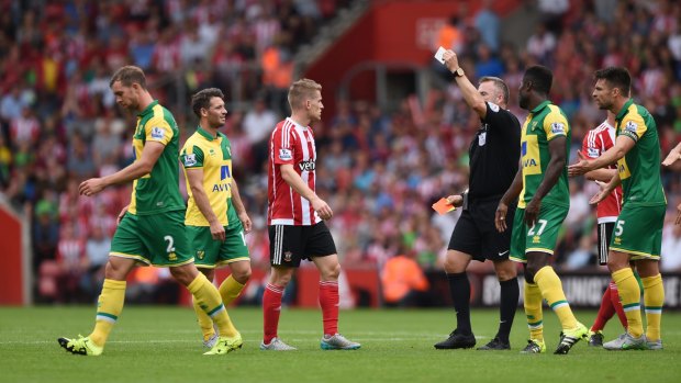 Referee Jonathan Moss gives Norwich's Steven Whittaker his marching orders.