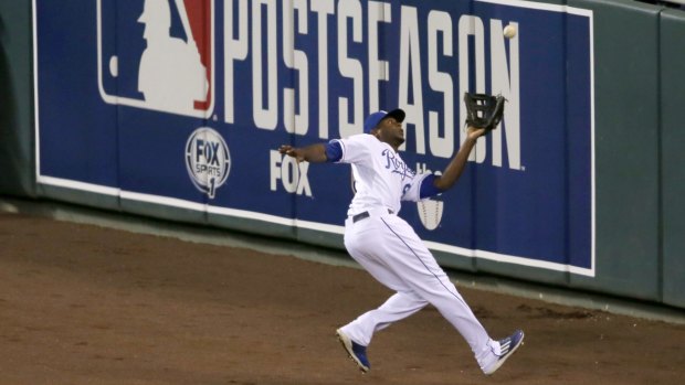 Royals' Lorenzo Cain takes a catch.