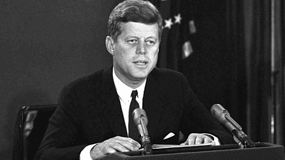 President John F. Kennedy announces a naval blockade of Cuba until Soviet missiles are removed. 