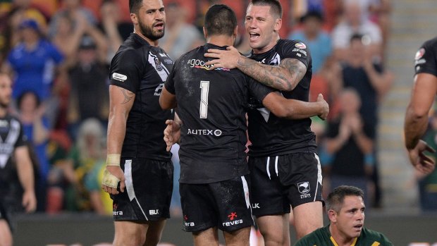 Kangaroo cull: Corey Parker cuts a disconsolate figure as New Zealand celebrate victory on Saturday night.