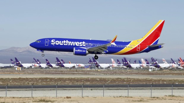 A Southwest Airlines Boeing 737 Max lands at the Southern California Logistics Airport in the high desert town of Victorville.
