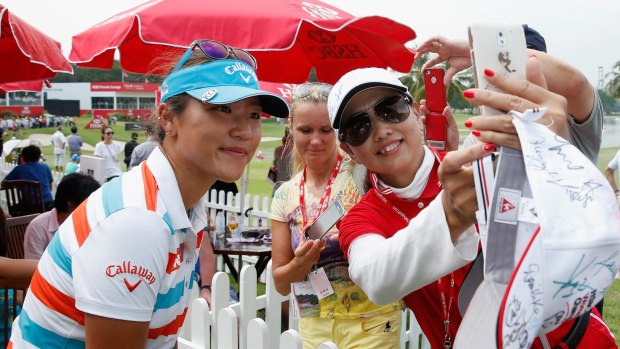 The champ: Lydia Ko poses for a fan in Singapore. 