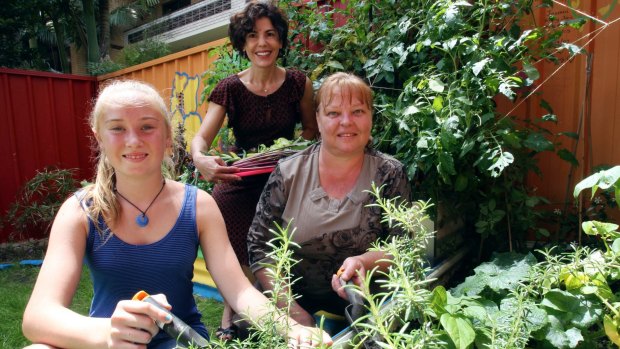 Nazha Saad (centre), CEO of St George Community Housing, at a permaculture garden created by St George Community Housing for residents.